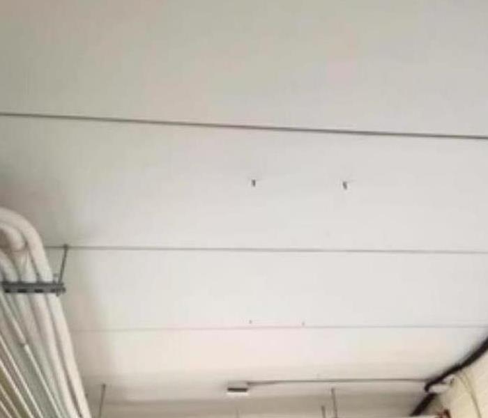 soot removed from ceiling after fire