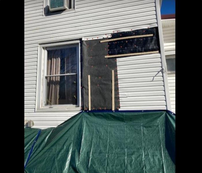 house tarped after damage 