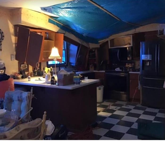 blue tarp on ceiling of kitchen